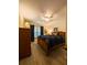 Cozy bedroom with a queen-sized bed, wood flooring, and natural light from the window at 7828 Hardwick # 923, New Port Richey, FL 34655