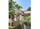 Inviting two-story townhome with covered entry, well-maintained landscaping, and a welcoming facade at 7828 Hardwick # 923, New Port Richey, FL 34655