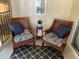 Cozy screened lanai with comfortable wicker chairs and a view at 7828 Hardwick # 923, New Port Richey, FL 34655