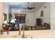 Inviting living room with comfortable seating, ceiling fan, and natural light streaming through window at 7828 Hardwick # 923, New Port Richey, FL 34655