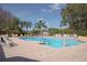 Community pool with lush landscaping at 7828 Hardwick # 923, New Port Richey, FL 34655