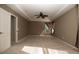 Bedroom showcasing a tray ceiling, fan, carpet and natural light at 11102 Avery Oaks Dr, Tampa, FL 33625