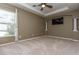 Bedroom with a ceiling fan, inset wall design, television, and natural light at 11102 Avery Oaks Dr, Tampa, FL 33625
