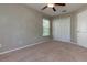 Bedroom featuring a ceiling fan, closet and window at 11102 Avery Oaks Dr, Tampa, FL 33625