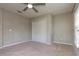 Bedroom with neutral walls, carpet, and closet providing ample space and natural light at 11102 Avery Oaks Dr, Tampa, FL 33625