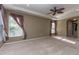 Bedroom featuring neutral carpet and view of backyard at 11102 Avery Oaks Dr, Tampa, FL 33625