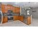 Well-lit kitchen showcasing granite countertops, stainless steel appliances, and tile flooring at 11102 Avery Oaks Dr, Tampa, FL 33625