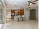 Bright, open-concept living space connects seamlessly to a kitchen with counter seating at 11102 Avery Oaks Dr, Tampa, FL 33625