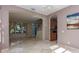 Inviting living area featuring tile floors, an archway, and abundant natural light at 11102 Avery Oaks Dr, Tampa, FL 33625