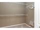 Walk-in closet with white wire shelving and neutral paint at 11102 Avery Oaks Dr, Tampa, FL 33625