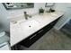 Modern bathroom featuring a double vanity with marble countertops and black cabinetry at 1120 E Kennedy Blvd # 1208, Tampa, FL 33602