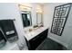 Modern bathroom featuring double sinks, granite countertops, sleek cabinetry, and stylish decor at 1120 E Kennedy Blvd # 1208, Tampa, FL 33602