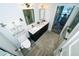 Modern bathroom with a double vanity, toilet, a soft rug and view to the bedroom at 1120 E Kennedy Blvd # 1208, Tampa, FL 33602
