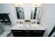 Bathroom featuring a double vanity with marble countertop and stylish fixtures and modern lighting at 1120 E Kennedy Blvd # 1208, Tampa, FL 33602