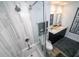Sleek bathroom with a glass-enclosed shower, soaking tub, and double vanity with stylish lighting at 1120 E Kennedy Blvd # 1208, Tampa, FL 33602