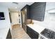 Updated kitchen with stainless steel refrigerator, and dark cabinets, providing a modern feel at 1120 E Kennedy Blvd # 1208, Tampa, FL 33602