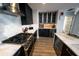 Modern kitchen with stainless steel appliances, marble counter tops and backsplash, and sleek cabinetry at 1120 E Kennedy Blvd # 1208, Tampa, FL 33602