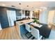 Modern kitchen with stainless steel appliances, sleek cabinetry, stylish island with seating, and contemporary lighting fixtures at 1120 E Kennedy Blvd # 1208, Tampa, FL 33602