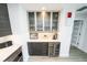 Kitchen area with stainless steel appliances, beverage cooler, frosted glass cabinets and decorative lighting at 1120 E Kennedy Blvd # 1208, Tampa, FL 33602