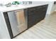 Kitchen island sink with stainless steel dishwasher and modern fixtures at 1120 E Kennedy Blvd # 1208, Tampa, FL 33602