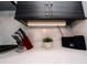 Close-up of kitchen counter featuring modern cabinets and marble backsplash at 1120 E Kennedy Blvd # 1208, Tampa, FL 33602