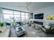 Spacious living room with large windows offering city views and modern decor at 1120 E Kennedy Blvd # 1208, Tampa, FL 33602