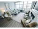 Bright living room with modern decor, large windows, and city views and featuring a marble fireplace at 1120 E Kennedy Blvd # 1208, Tampa, FL 33602