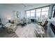 Open-concept living room featuring modern decor, expansive windows, and city views at 1120 E Kennedy Blvd # 1208, Tampa, FL 33602