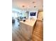 Bright open-concept with marble countertop and view of the living room with fireplace and entertainment center at 1120 E Kennedy Blvd # 1208, Tampa, FL 33602
