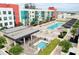 A complex featuring a shared pool, hot tub, sundeck and outdoor dining areas in a modern building at 1120 E Kennedy Blvd # 1208, Tampa, FL 33602
