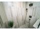 Luxurious walk-in shower featuring floor to ceiling marbled tile and modern shower fixtures at 1120 E Kennedy Blvd # 1208, Tampa, FL 33602