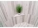 Modern shower with decorative plant and tiled walls, offering a luxurious bathing experience at 1120 E Kennedy Blvd # 1208, Tampa, FL 33602