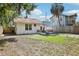 Cozy backyard featuring a quaint patio and a patch of green lawn, perfect for outdoor relaxation and entertaining at 1125 19Th N Ave, St Petersburg, FL 33704