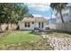 Backyard featuring green grass, stone pathway and brick patio at 1125 19Th N Ave, St Petersburg, FL 33704
