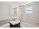 Cozy bathroom with tiled shower and vanity, and a large mirror at 1125 19Th N Ave, St Petersburg, FL 33704