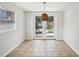 Sunlit dining area with stylish pendant lighting and backyard views through the French doors at 1125 19Th N Ave, St Petersburg, FL 33704