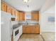 This kitchen is equipped with modern appliances, tile floors, and wood cabinetry at 1125 19Th N Ave, St Petersburg, FL 33704