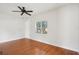 Spacious living room featuring a ceiling fan, natural light and hardwood flooring at 1125 19Th N Ave, St Petersburg, FL 33704