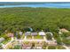 Aerial view showing the home's location within a quiet neighborhood near a lake at 1144 Lanyard St, Palm Harbor, FL 34685