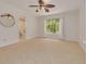 Bedroom with a view of the attached bathroom, and a window for natural lighting at 1144 Lanyard St, Palm Harbor, FL 34685