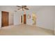 Bedroom with doors to an attached closet and bathroom, and tile flooring at 1144 Lanyard St, Palm Harbor, FL 34685