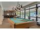 Resident billiards and game room with pool table and seating for multiple players at 1144 Lanyard St, Palm Harbor, FL 34685