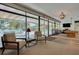 Common room with pool table, seating area, and views of the outdoor pool area at 1144 Lanyard St, Palm Harbor, FL 34685
