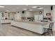 Spacious kitchen with long countertops, white cabinets, and modern appliances for easy meal preparation at 1144 Lanyard St, Palm Harbor, FL 34685