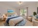 This main bedroom has beautiful decor and a window with curtains allowing for natural light at 1144 Lanyard St, Palm Harbor, FL 34685