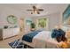 Main bedroom with beautiful decor, a window for natural light, and access to an attached bathroom at 1144 Lanyard St, Palm Harbor, FL 34685