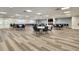 Large community meeting room with wood floors, tables, chairs, and television at 1144 Lanyard St, Palm Harbor, FL 34685