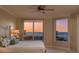Bright bedroom featuring a serene ocean view through large windows at 1170 Gulf Blvd # 402, Clearwater, FL 33767