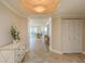 The residence's foyer features tile flooring, decorative lighting, and closet storage at 1170 Gulf Blvd # 402, Clearwater, FL 33767