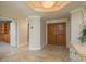 The residence's foyer features a double-door entry and decorative lighting at 1170 Gulf Blvd # 402, Clearwater, FL 33767
